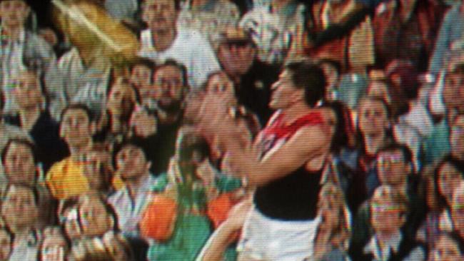 1995. Shaun Smith goes high for the mark over teammate Garry Lyon. Brisbane Bears v Melbourne. Gabba. Screen grab. Picture: Channel Seven Sport.