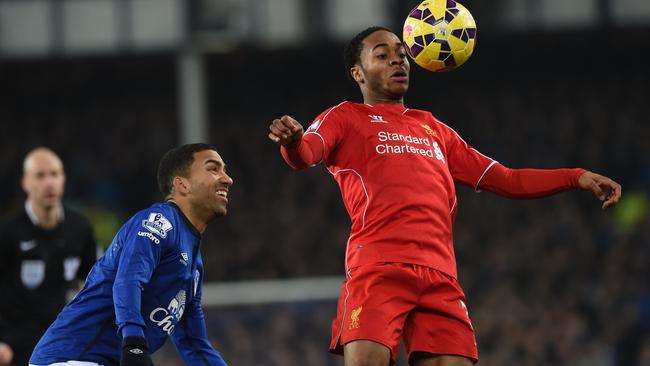 Liverpool's English midfielder Raheem Sterling (R) vies with Everton's English midfielder Aaron Lennon (L) during the English Premier League football match between Everton and Liverpool at Goodison Park in Liverpool on February 7, 2015. AFP PHOTO / PAUL ELLIS RESTRICTED TO EDITORIAL USE. No use with unauthorized audio, video, data, fixture lists, club/league logos or “live” services. Online in-match use limited to 45 images, no video emulation. No use in betting, games or single club/league/player publications.