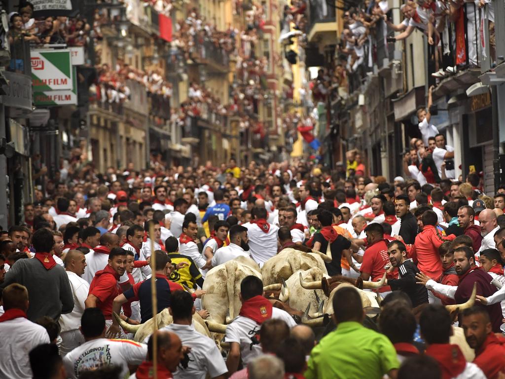 There’s not much room to move when the bulls charge though the streets. Stragglers can get unlucky. Photo: Alvaro Barrientos