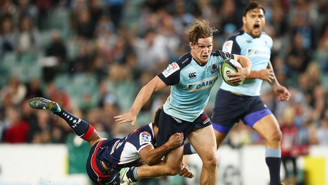 Michael Hooper of the Waratahs is tackled at Allianz Stadium.