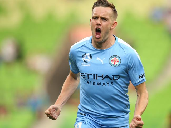 Craig Noonev celebrates after his brilliant strike against Newcastle Jets.