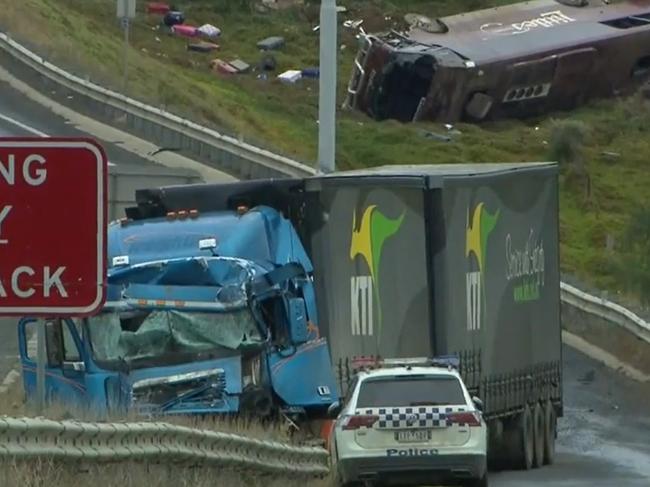 A school bus carrying 32 people has flipped on the Western Highway in Bacchus Marsh on November 21, 2022., Police are investigating the crash between a school bus and a truck that occured at around 3.15am. Picture: Nine News