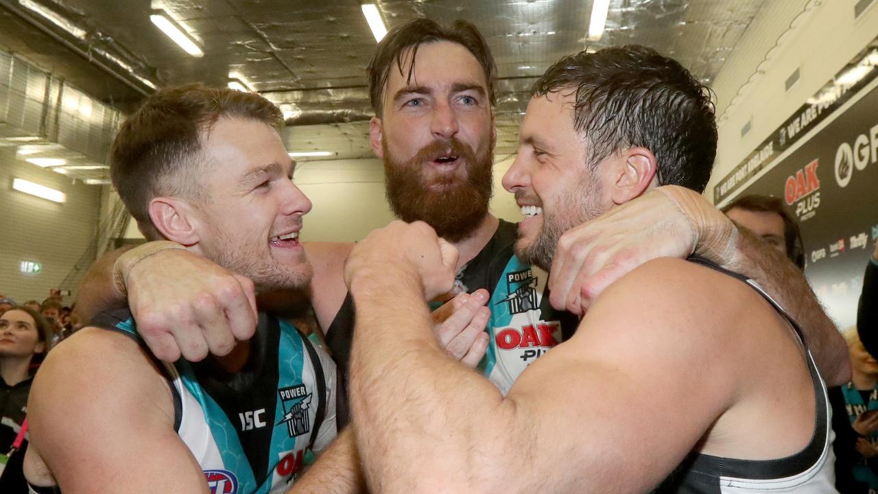 Robbie Gray, Charlie Dixon and Travis Boak sing the club song last year.