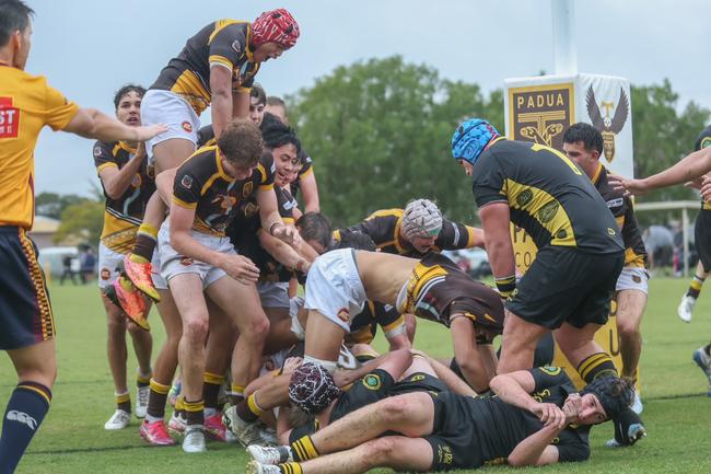 Teammates get around tom O’Regan for scoring.