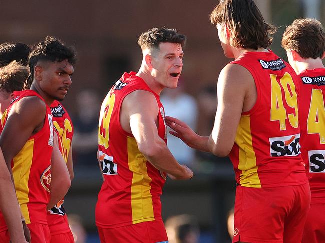 MELBOURNE, AUSTRALIA - SEPTEMBER 24: Christopher Burgess of the Suns celebrates during the VFL Grand Final match between Gold Coast Suns and Werribee at Ikon Park on September 24, 2023 in Melbourne, Australia. (Photo by Kelly Defina/AFL Photos/via Getty Images)