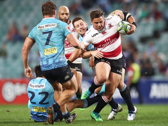 SYDNEY, AUSTRALIA - APRIL 20:  Rohan Janse van Rensburg of the Lions is tackled during the round 10 Super Rugby match between the Waratahs and the Lions at Allianz Stadium on April 20, 2018 in Sydney, Australia.  (Photo by Matt King/Getty Images)