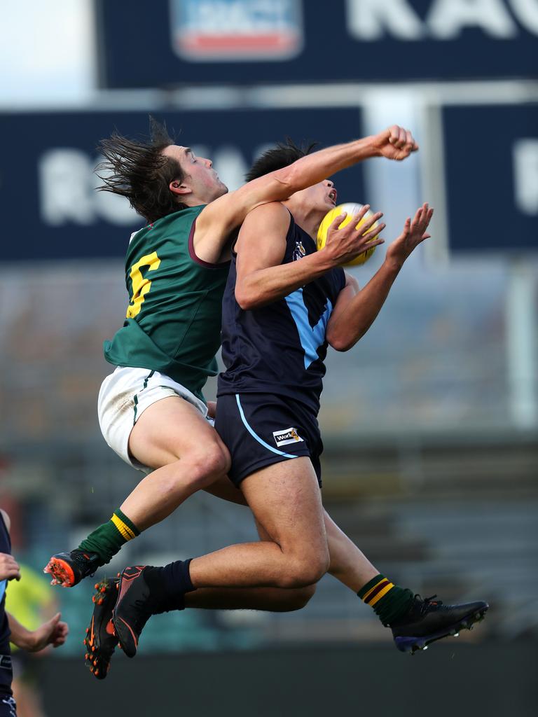 Tasmania Aiden Grace and Vic Metro Joseph Fisher contest a mark during the game against Vic Metro at UTAS Stadium. PICTURE CHRIS KIDD