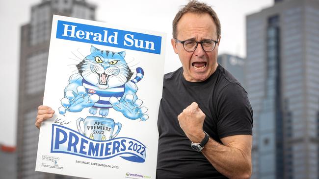 Knight with the 2022 AFL Premiership poster, which always proves to be a favourite of footy fans. Picture: Mark Stewart