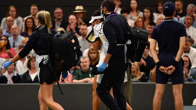 Britain's Emma Raducanu (C) takes a medical time out