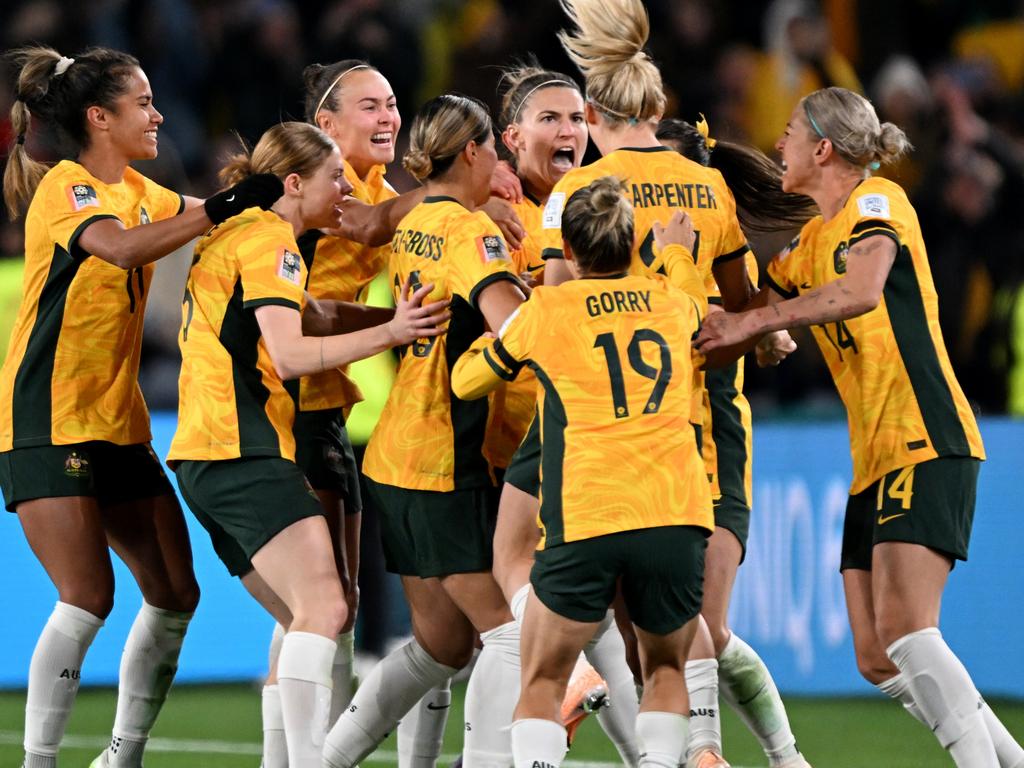 SYDNEY, AUSTRALIA – JULY 20: Australia players celebrate the team's first goal scored by Steph Catley (obscured) during the FIFA Women's World Cup Australia &amp; New Zealand 2023 Group B match between Australia and Ireland at Stadium Australia on July 20, 2023 in Sydney, Australia. (Photo by Bradley Kanaris/Getty Images)