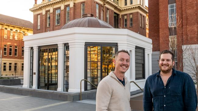 Aussie actor and Community owner Brett Hicks-Maitland with chef Sam Worrall-Thomson, pictured in front of the Sheridan building on North Terrace. Picture: Greg Adams/Renewal SA.