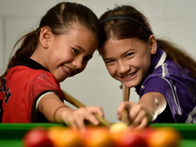 Sisters Mila, 7, and Xava Williamson, 8, are the youngest members of the Townsville 8 Ball Association. Picture: Evan Morgan