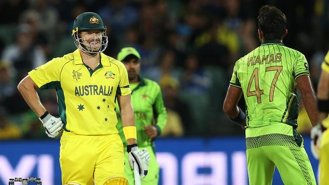 Shane Watson smiles as Pakistan's Wahab Riaz gives it to him. Picture: Phil Hillyard.