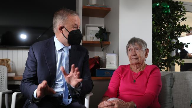 The positive Covid result came just hours after he visited a retirement village in Nowra (pictured above wearing a mask while meeting resident Pat Morrison, 89) Picture: Toby Zerna