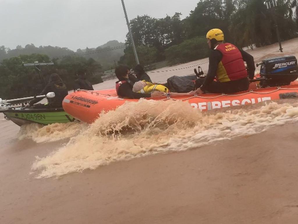 A rescue boat travels down Ballina St in South Lismore.