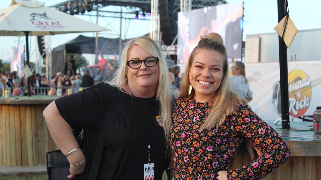 SOUNDS OF ROCK: Jacelyn Woodrowe and Natasha Schwehla enjoying an afternoon of live music.