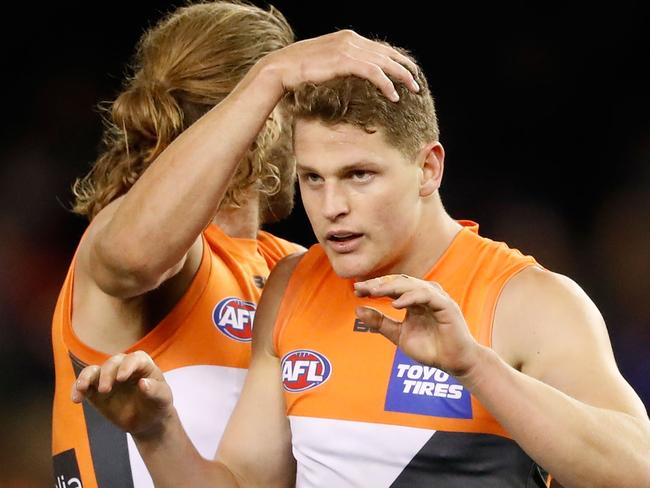 MELBOURNE, AUSTRALIA - AUGUST 27: Jacob Hopper of the Giants celebrates a goal with Callan Ward of the Giants during the 2016 AFL Round 23 match between the North Melbourne Kangaroos and the GWS Giants at Etihad Stadium on August 27, 2016 in Melbourne, Australia. (Photo by Adam Trafford/AFL Media/Getty Images)