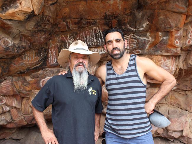 Going back ... Adam Goodes with Cliff Coulthard at the Malkawi cave painting site in The Flinders Rangers in South Australia. Picture: SBS