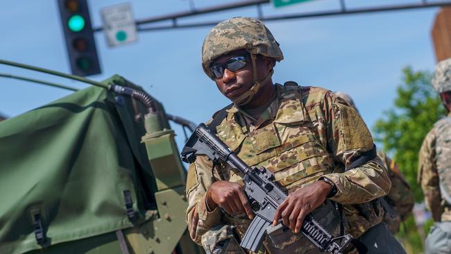 A national Guard stands outside of the state capital building in Saint Paul, Minnesota.