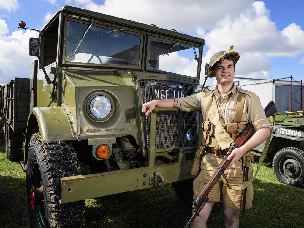 2nd/15th Australian Infantry Battalion reenactor group member Jacob Augostin stands with a 19434 Chevrolet Blitz on show at the David Hack Classic, Sunday, May 18, 2025. Picture: Kevin Farmer