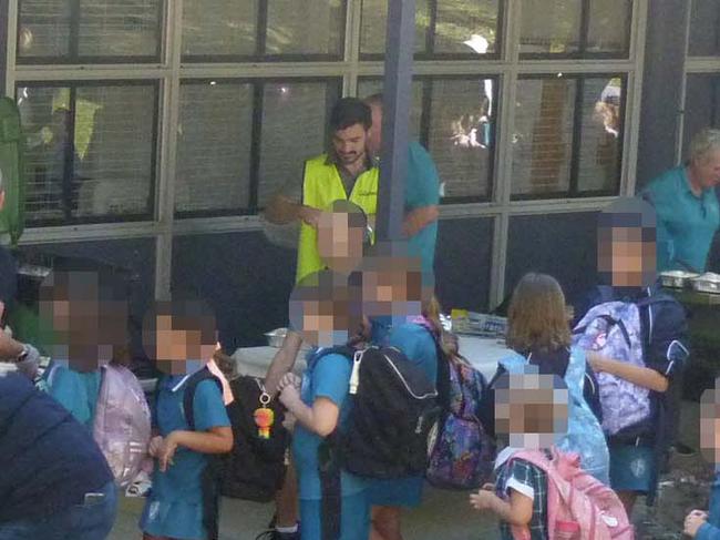 Cr Ryan Bayldon-Lumsden (centre) attending an event at Arundel State School on Wednesday morning. Picture: Facebook.