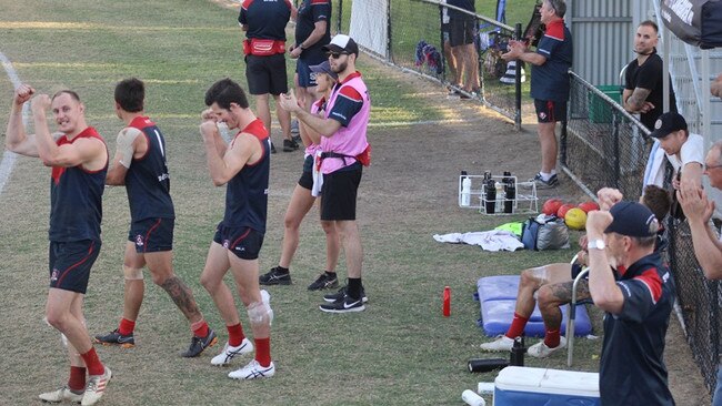 Demons players celebrate on the final siren after winning their way through to their first grand final in 15 years. Picture supplied.