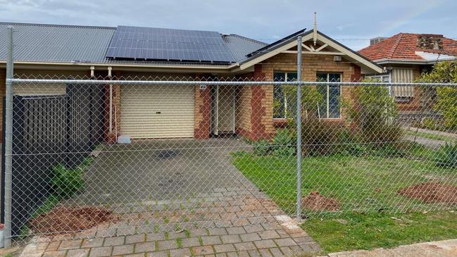 The state opposition has identified several empty fenced-off homes on the same street at Clovelly Park. Picture: Supplied