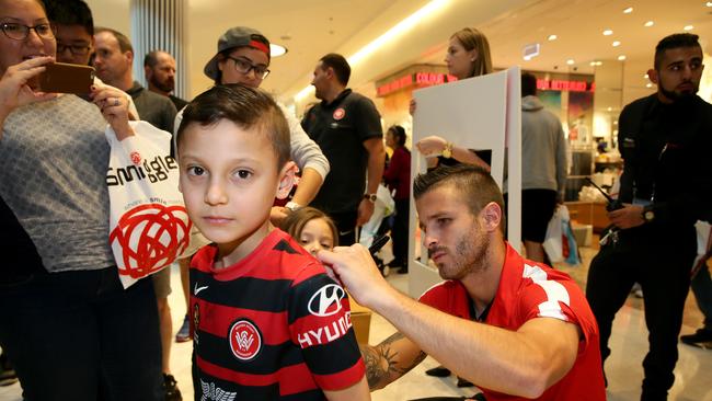 Western Sydney Wanderers player Nicolas Martinez signs autographs for Tiago Sencion 7, on September 27, 2016. Picture: Justin Sanson