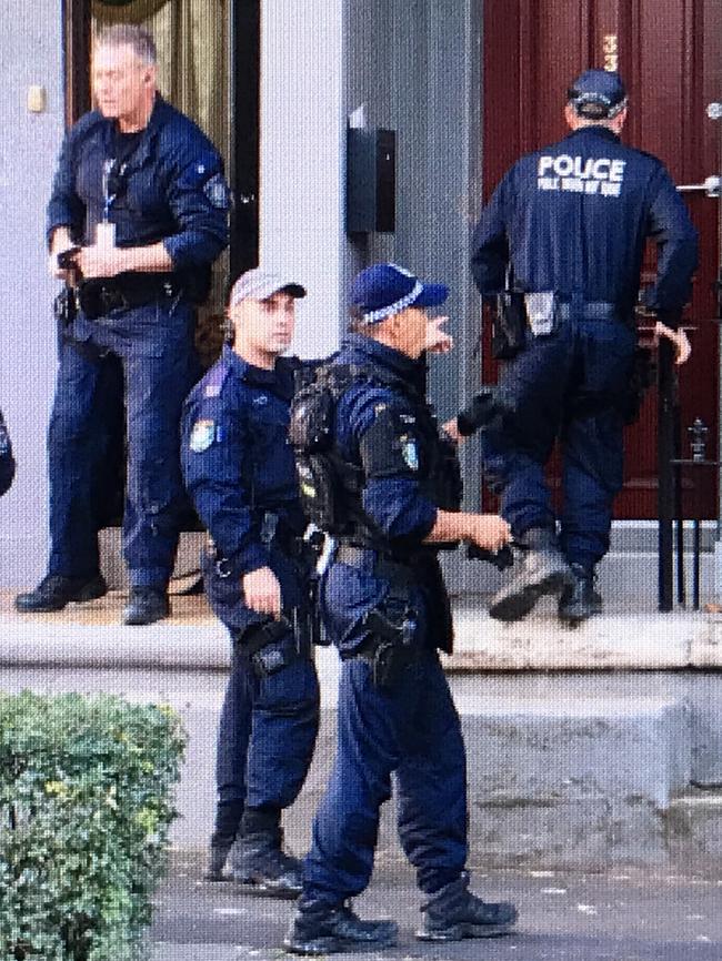 Heavily armed police stormed a terrace house in Surry Hills in a terror-related raid. Picture: Dylan Robinson