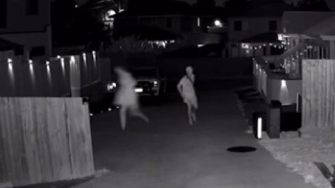 A screenshot from security vision of two people on a property in Rochedale on Friday night.