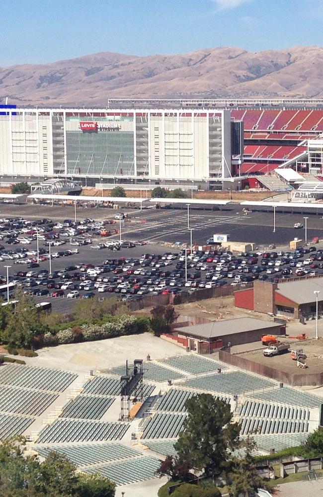 A view of the San Francisco 49ers’ Levi’s Stadium, with the car park in the foreground and the Diablo Range in the background.