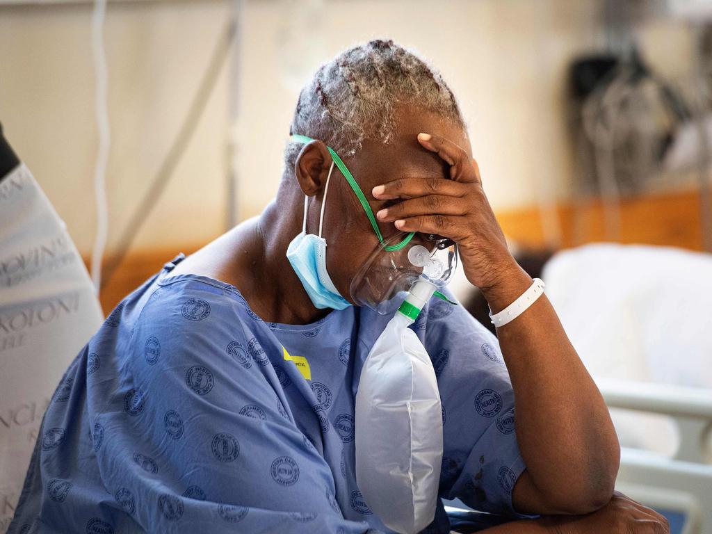 A patient with Covid-19 breaths in a ward at Khayelitsha Hospital, about 35km from the centre of Cape Town. South Africa is the hardest hit country on the African continent. Picture: AFP