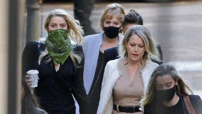 US actress Amber Heard, left, outside the High Court in London. Picture: AFP