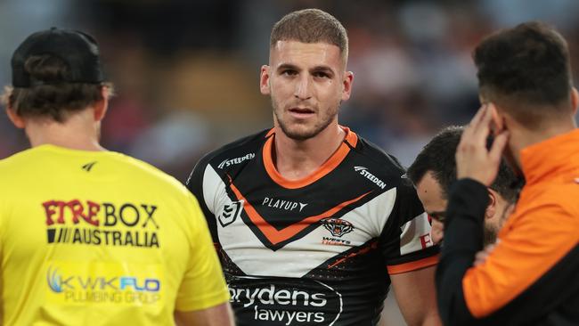 SYDNEY, AUSTRALIA - APRIL 10: Adam Doueihi of the Wests Tigers walks from the field injured during the round six NRL match between Wests Tigers and Parramatta Eels at Accor Stadium on April 10, 2023 in Sydney, Australia. (Photo by Mark Metcalfe/Getty Images)