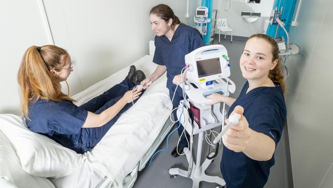 Runcorn State High School Health Academy. Year 12 students Jayde McLennan, Sara-Jo Scott and Teagan Currie train in the new remote intensive care unit. Thursday, October 8 2020. Picture: Renae Droop