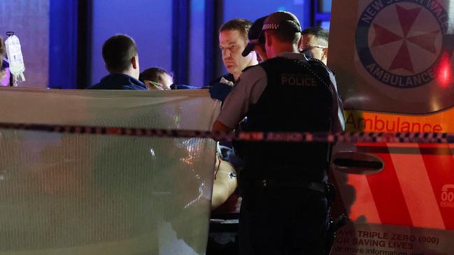 Police and paramedics tend to Acherkouk was shot in Surry Hills. Picture: Matrix News