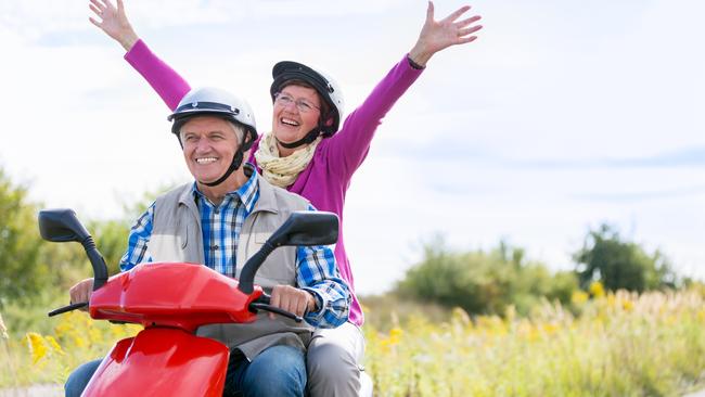 Happy senior couple on motor scooter. For Herald Sun Realestate retirement story 24MAR18. iStock image.