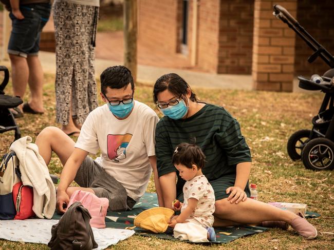 People at the evacuation centre in Swanview wait out the nearby fires. Picture: NCA NewsWire / Tony McDonough