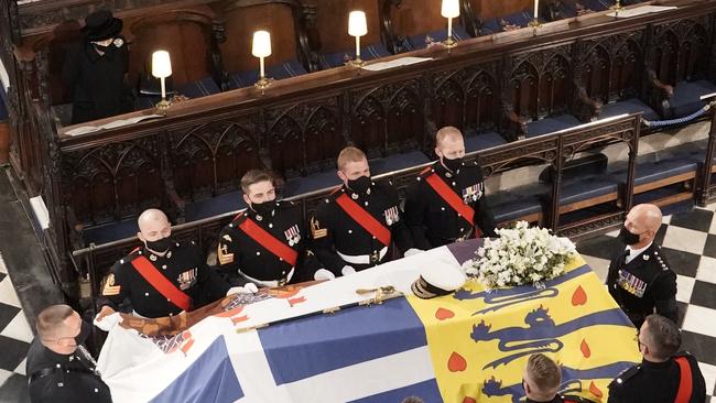 : Queen Elizabeth II watches as the coffin of Prince Philip is placed at St George's Chapel. Picture: Getty Images.