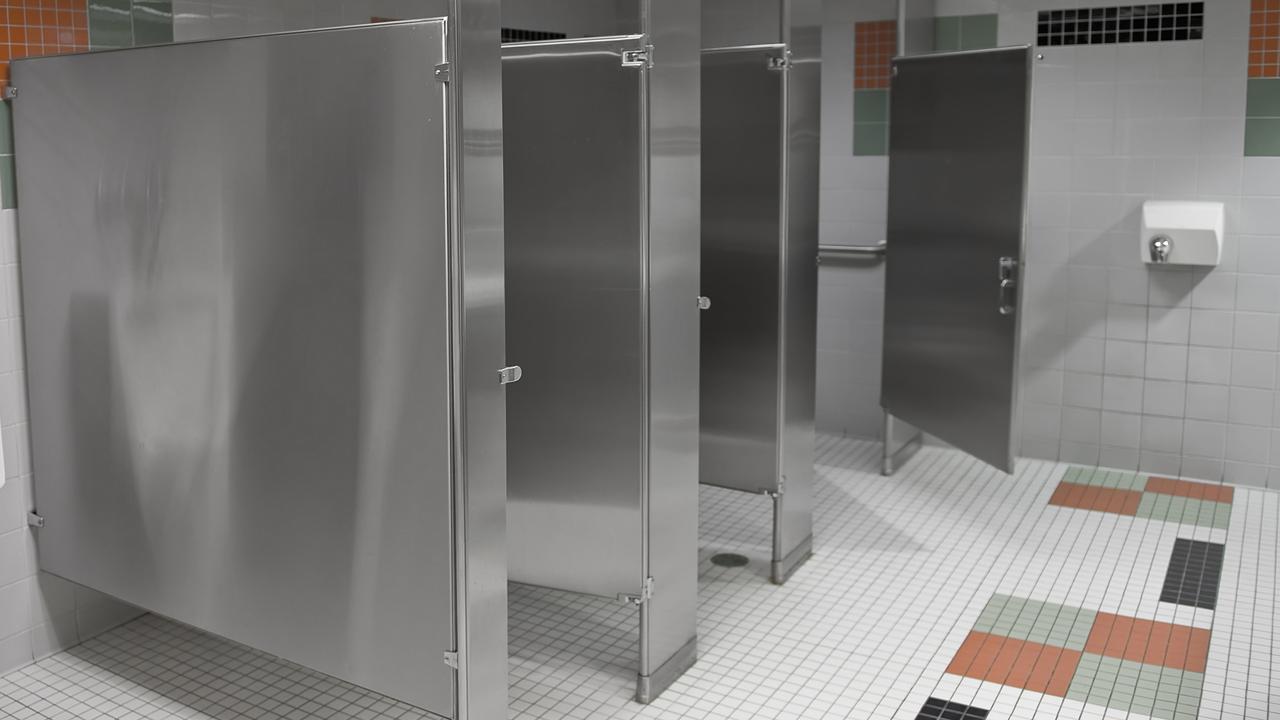 Travellers are baffled by the large gaps around toilet stall doors in America. Picture: istock