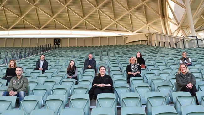 Adelaide Oval staff Peter Papas, Douglas Barlow, Fredereic Hannagan, Lucy Johnson, middle, Alice McKeough, Jemma Matthews, Sadie Wright, front, Scott Bray, Maria Pinneri, and Laura Robinson demonstrate how Showdown social distancing will work. Picture: Keryn Stevens