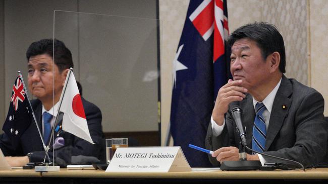 Toshimitsu Motegi, right, and Nobuo Kishi during the video conference. Picture: AFP