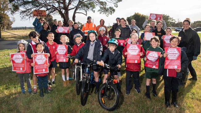 Jarvis Essing, Xanthe Essing and Silas Lamb with other students and parents are calling for a pedestrian crossing outside Christian College Surf Coast campus in Jan Juc. Picture: Brad Fleet