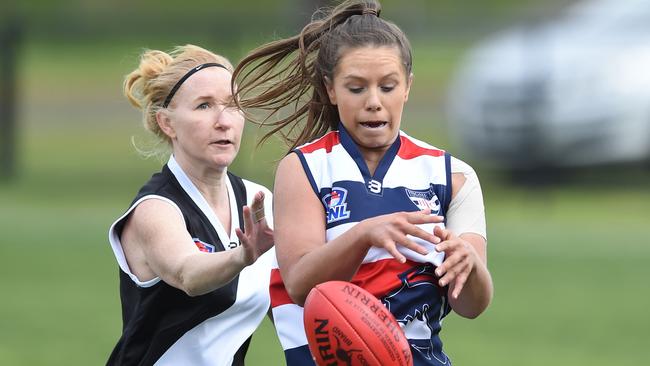 Oakleigh District and Highett players battle for the ball. Picture: Chris Eastman