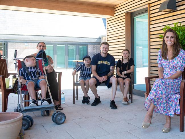 Catherine, Duchess of Cambridge talks with Sonny Saunders (left) and his family, mother Kelly, brother Hudson, father Jordan and sister Star, during a visit to The Nook in Framlingham Earl, Norfolk. picture: Getty