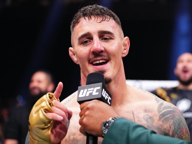 MANCHESTER, ENGLAND - JULY 27: Tom Aspinall of England reacts after his knockout victory against Curtis Blaydes in the interim UFC heavyweight championship bout during the UFC 304 event at Co-op Live on July 27, 2024 in Manchester, England.  (Photo by Chris Unger/Zuffa LLC via Getty Images)