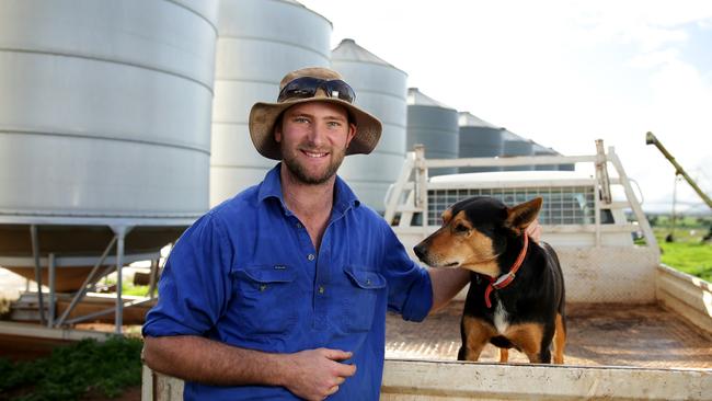 Farmer Dan Fox with his dog Batman on his farm in Marrar. Picture: Jonathan Ng