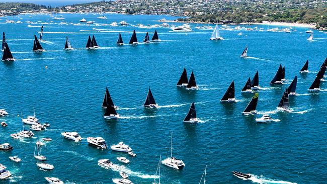 This handout image taken and received from Rolex on December 26, 2024 shows yachts competing at the start of the annual Sydney to Hobart yacht race on Boxing Day on Sydney Harbour. (Photo by Carlo Borlenghi / ROLEX / AFP)