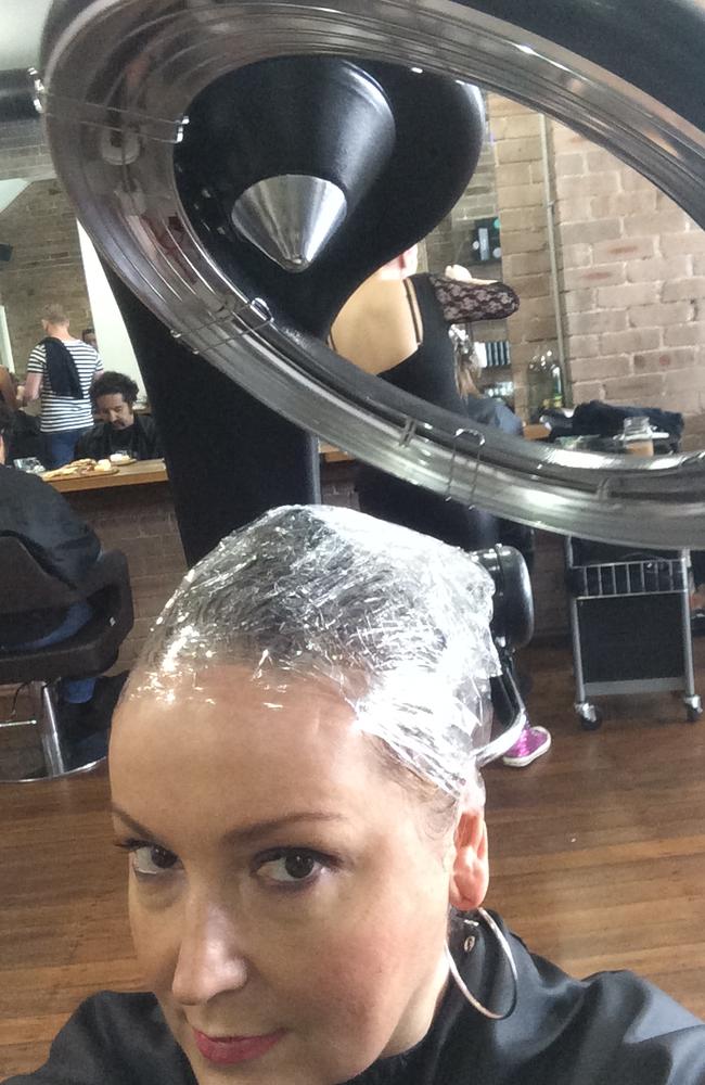 The heat is on: wrapped in plastic while the conditioner infuses into every follicle. Pic: Melissa Hoyer