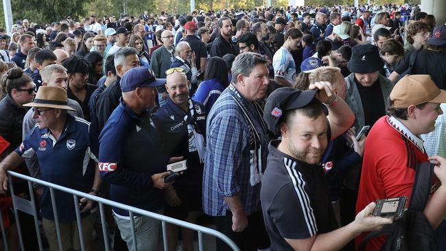 Soccer fans wait to get into stadium. Picture: Ian Currie